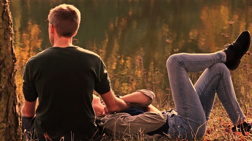 Guy and girl under tree