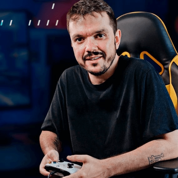 Gaules sitting on a gaming chair and holding a controller
