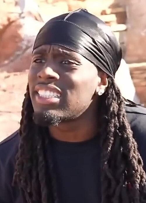 kai cenat in black looking confused